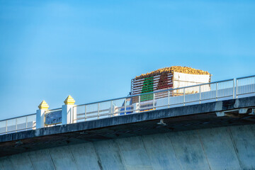 Truck on Thep Sada Bridge is a 2-lane reinforced concrete bridge across Lam Pao Dam at Kalasin,Thailand.