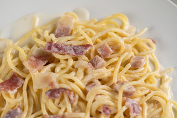 carbonara spaghetti with cream on white plate