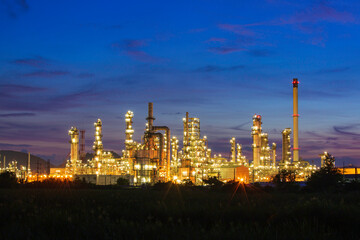 Oil​ refinery​ and​  plant and tower column of Petrochemistry industry in oil​ and​ gas​ ​industrial with​ cloud​ blue​ ​sky the morning