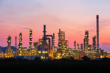 Oil​ refinery​ and​  plant and tower column of Petrochemistry industry in oil​ and​ gas​ ​industrial with​ cloud​ red sky