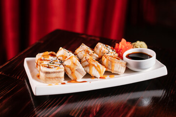 Sushi roll set with ginger and wasabi.