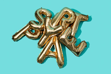 different golden letter-shaped balloons