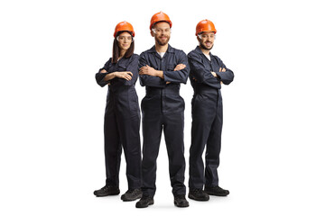 Team of workers in uniforms wearing helmets and goggles