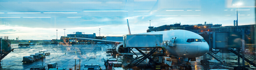 Fototapeta Everywhere is a just a flight away. Full length shot of an airplane in an airport courtyard. obraz