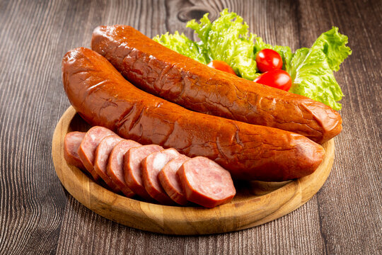 Raw smoked sausage on the table. Calabrese sausage.