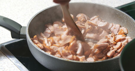 Sausage cuts frying on pan