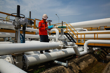 Naklejka premium Male worker inspection at valve of visual check record pipeline oil and gas