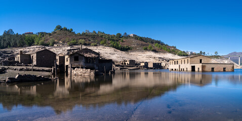 Fototapeta na wymiar long exposure view of the ghost town of Aceredo in the Alto Lindoso reservoir