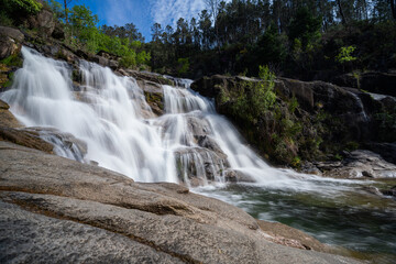 view of the Cascata Fecha de Barjas waterfalls in the Peneda-Geres National Park in Portugal