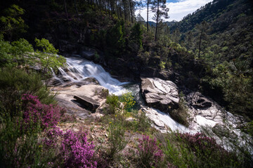 view of the Cascata Fecha de Barjas waterfalls in the Peneda-Geres National Park in Portugal