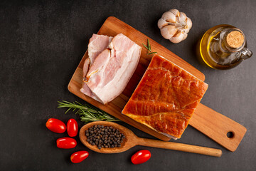 Sliced ​​raw bacon on the table.