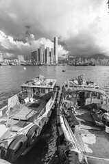 Fishing boat in Victoria Harbor of Hong Kong city