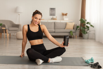 Black Fitness Lady Holding Cup Drinking Water During Workout Indoor