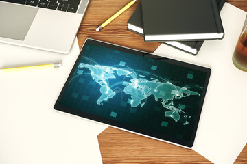 Modern digital tablet display with abstract graphic world map with connections, globalization...
