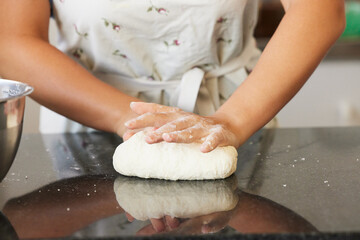 Never eat ingredients you cant pronounce. Shot of a unrecognizable female baking in the kitchen at home.