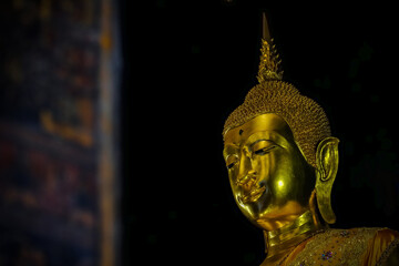 Fototapeta premium Wat Prayoon, a temple in Bangkok with beautiful Buddha images and murals.Photo taken on January 2, 2022 in Bamgkok,Thailand.