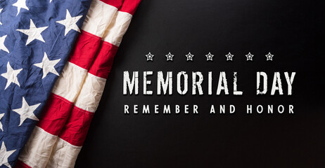 Happy memorial day concept made from American flag with the text on dark wooden background.