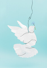 Peace dove with a flower on a blue background