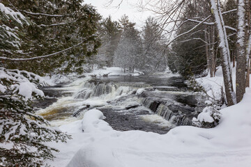 Frozen winter waterfall on river