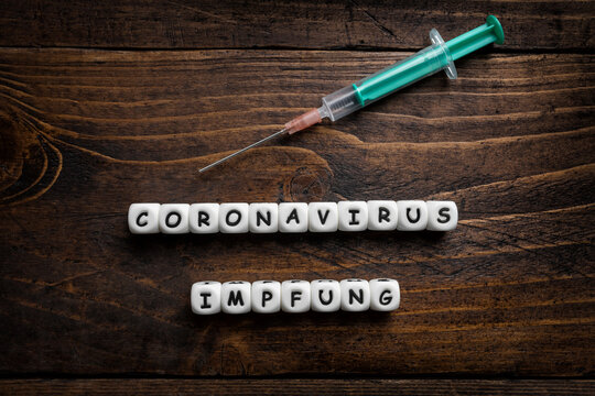 Corona virus Covid-19 vaccine text background in German