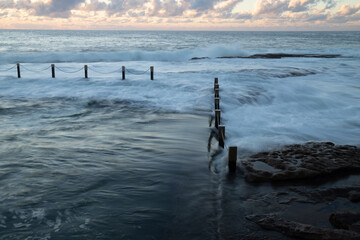 Maroubra rock pool overflow in high tide, Sydney, Australia.