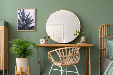 Elegant details of modern bedroom interior with wooden sideboard, chair, mock up poster, mirror and stylish personal accessories. Template.