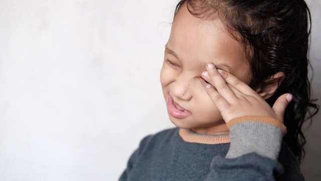a upset child girl looking down 