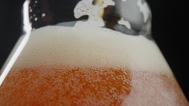 Close-up of beer being poured into a glass