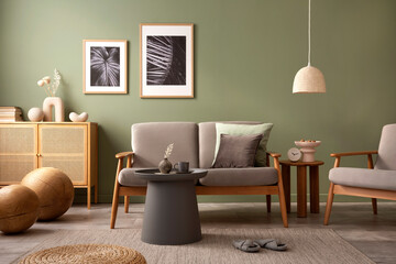 Elegant composition of living room interior. Modern scandi sofa, design pillows, side table, rattan...