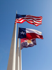 Dallas, TX,  USA - March 20, 2022: Texas and American flag with ATT headquarters building in the...