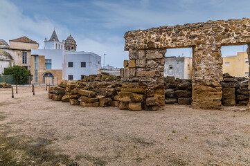 A view past the ruins of the roman ampitheatre in the city of Cadiz on a spring day