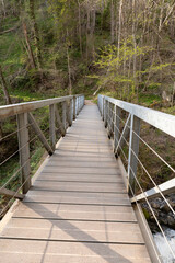 Naklejka na ściany i meble Small bridge on a hiking trail in Weesen in Switzerland