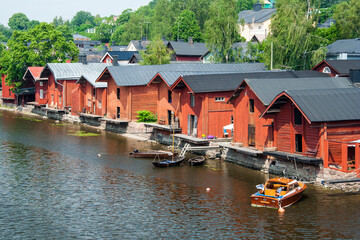 Red shore warehouses on the riverbank of Porvoonjoki river. Porvoo, Finland