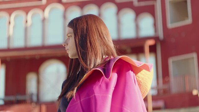 Young Girl With Matador Cape Looking Afar On A Sunny Summer Day. - low angle, static