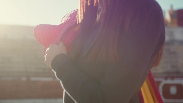 Sunlit Torero Girl With Cape At Bullring. - close up, crop