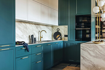 Luxury modern and vintage turquoise and white kitchen. Marble kitchen island with white owal chandelier . Gold tap on marble table top. Template.