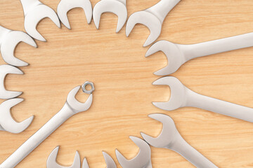 Minimal  wrenches or spanners arrange be circle with copy space for text with wooden background....
