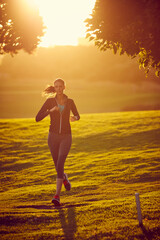 Shape up to a healthier you. Shot of a sporty young woman exercising outdoors.