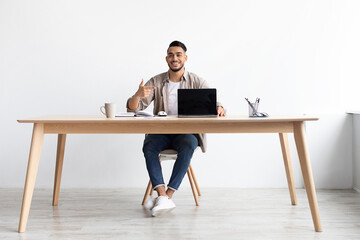 Happy Arab Guy Showing Laptop With Black Empty Screen, Mockup