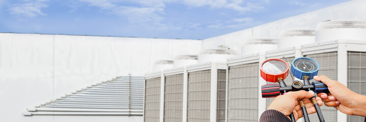Technician checking the operation of the air conditioner