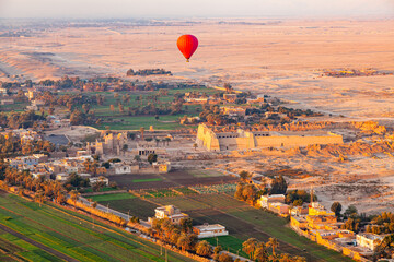 Hot air balloon flying above The Mortuary Temple of Ramesses III at Medinet Habu.