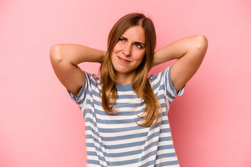 Young caucasian woman isolated on pink background suffering neck pain due to sedentary lifestyle.