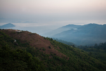 Morning fog over the mountain in Kyaiktiyo, Myanmar