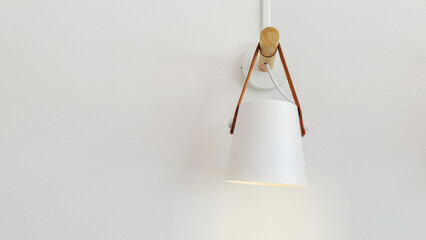 Loft style interior design of electric light bulb décor hanging on concrete wall. Classic...