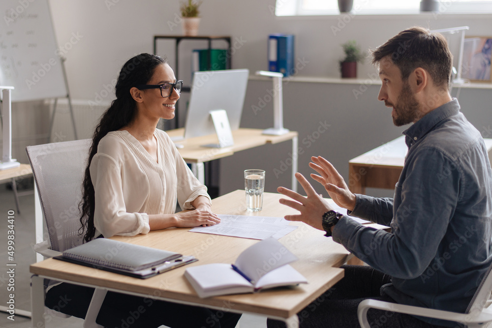 Wall mural HR manager interviewing potential employee at modern company office. Personnel recruitment, corporate headhunting