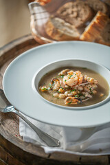 Seafood Soup on White Plate with Bread, Restaurant food