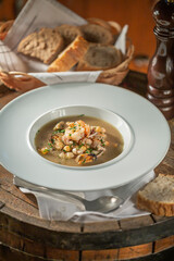 Seafood Soup on White Plate with Bread, Restaurant food