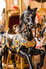 Fototapeta na wymiar Close up - detail of an outdoor carousel in a square in Florence, Italy