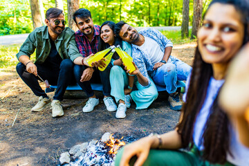 Multiracial pakistanian happy friends at picnic camping park