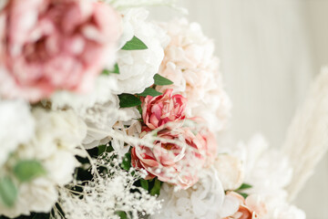 Pastel colors wedding bouquet Beautiful blossoming flowers (roses, hydrangeas, carnations, eustoma) in white, pink, and peach colors Close up